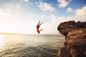 Cliff Jumping into the Ocean at Sunset, Outdoor Adventure Lifestyle